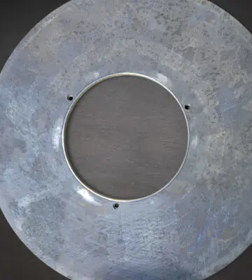 Cleaned stainless steel industrial filter after restoration.