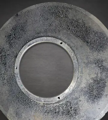 Contaminated stainless steel filter before industrial cleaning and restoration.